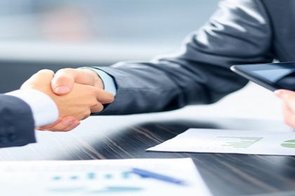 Business people shaking hands in office